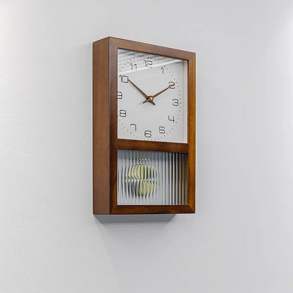 Japanese Silent Pendulum Clock - Close-up of gold swinging pendulum behind acrylic glass panel